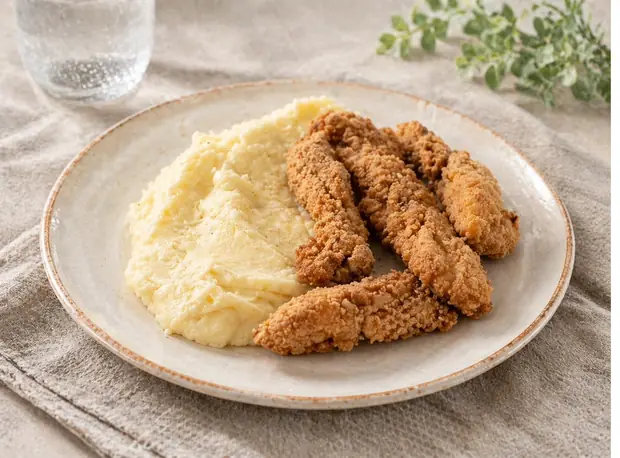 Chicken fingers con puré de papas
